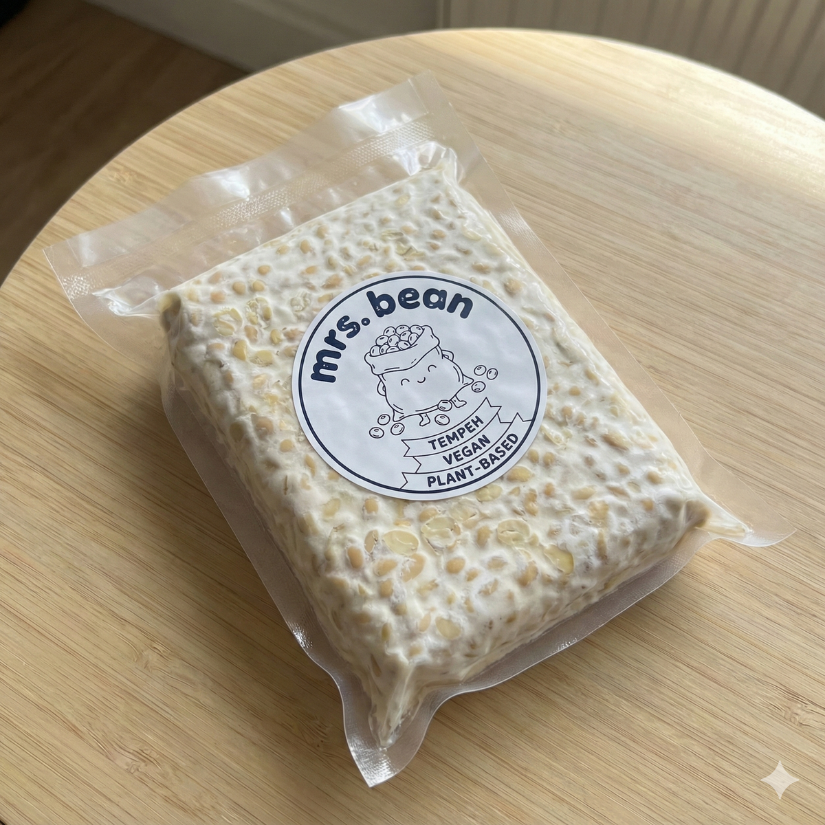 Packaged product with 'mrs. bean' label on a wooden surface