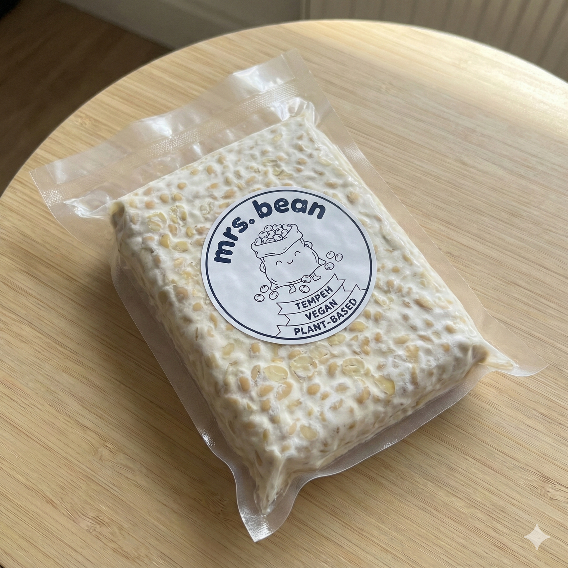 Packaged product with 'mrs. bean' label on a wooden surface